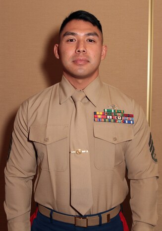 Staff Sgt. Anourack D. Phavorachith, career planner, 3rd Battalion, 11th Marine Regiment, received the Inchon Trophy for outstanding achievement in 2013 during the 1st Marine Division Annual Career Planning Awards Luncheon at Marine Corps Base Camp Pendleton, Calif., Jan. 27, 2014. Phavorachith, a 30-year-old native of Fresno, and 2001 graduate of Hoover High School, is assigned to an artillery battalion based in Marine Corps Air Ground Combat Center Twentynine Palms. He is required to interview Marines in the battalion several times throughout their careers and assist them in reenlisting, transitioning successfully to a civilian career or pursuing higher education. Phavorachith is one of many career planners serving more than 25,000 combat-ready Marines and Sailors throughout 1st Marine Division.
 (U.S. Marine Corps photo by Sgt. Jacob H. Harrer / released)
