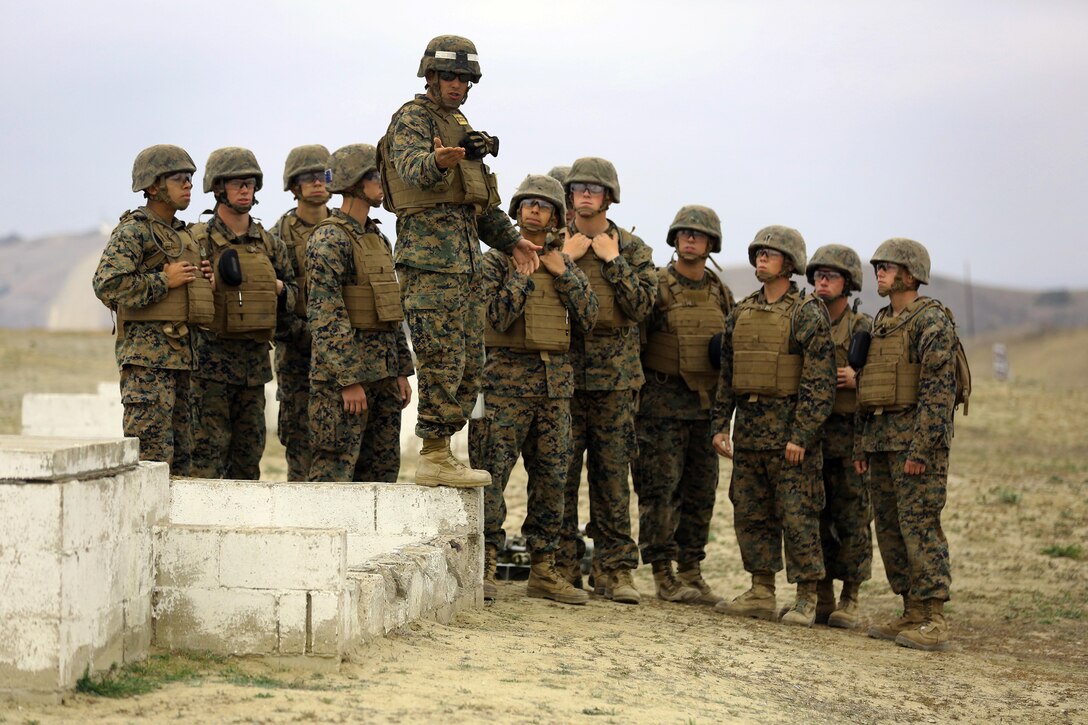 Sgt. Michael Conte speaks to students of Delta Company, Infantry Training Battalion before starting their training exercise at Camp Pendleton on Jan. 30. Conte explains what they will be doing and where they will be shooting. Conte is a mortar combat instructor with Delta Co. 

Infantry Training Battalion trains all infantry, entry-level Marines in the infantry skills essential to operating combat environment. Infantry Training Battalion is a 52-day training course that transforms the raw Marine into an infantryman who can fight, survive, and win in a combat situation.
