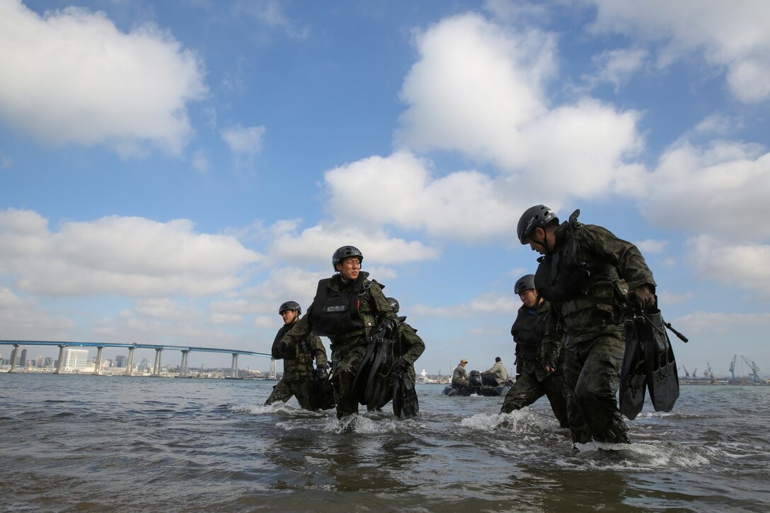 Soldiers with the Japan Ground Self-Defense Force make their way onto Seal Beach while conducting Helo Cast training with 1st Reconnaissance Battalion, 1st Marine Division, during Exercise Iron Fist 2014 aboard Naval Amphibious Base Coronado, Calif., Jan. 27, 2014. Iron Fist is an amphibious exercise that brings together Marines and sailors from the 15th Marine Expeditionary Unit, other I Marine Expeditionary Force units, and soldiers from the JGSDF, to promote military interoperability and hone individual and small-unit skills through challenging, complex and realistic training. (U.S. Marine Corps photo by Cpl. Emmanuel Ramos/Released)