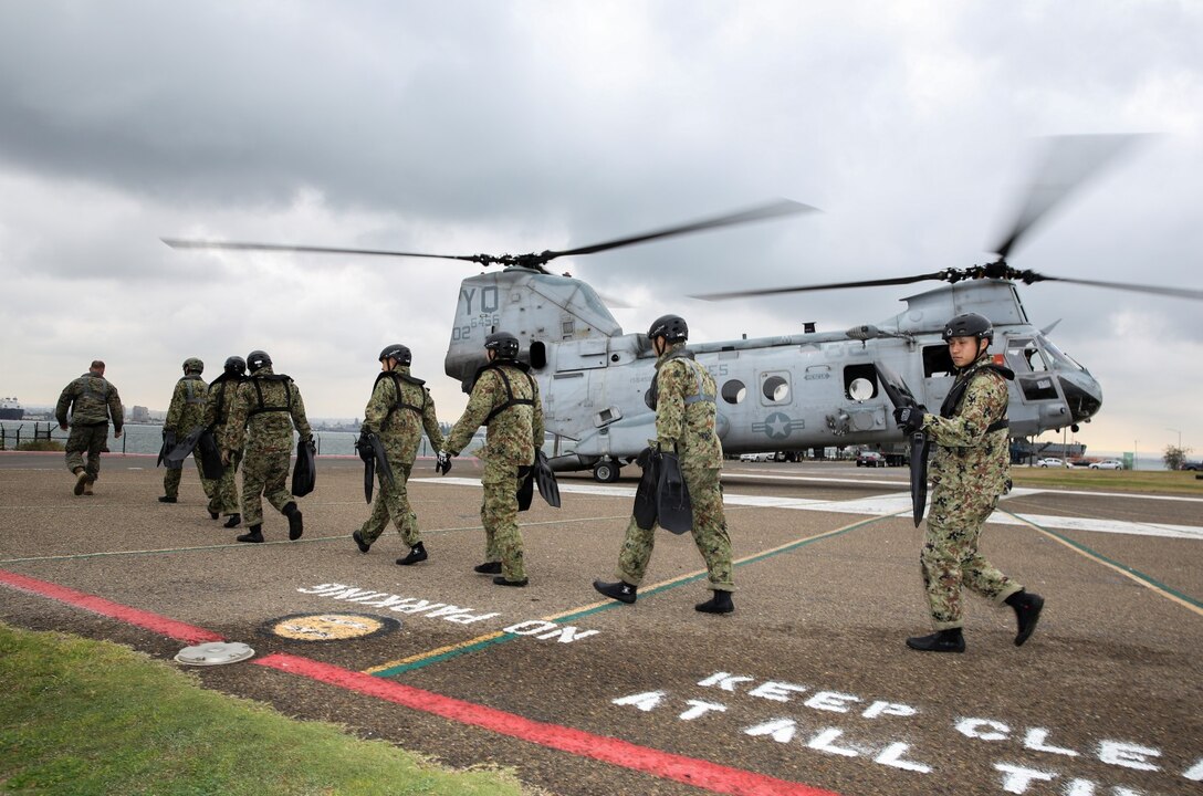 Soldiers with the Japan Ground Self-Defense Force make their way to a CH-46E Sea Knight while conducting Helo Cast training during Exercise Iron Fist 2014 aboard Naval Amphibious Base Coronado, Calif., Jan. 27, 2014. Iron Fist is an amphibious exercise that brings together Marines and sailors from the 15th Marine Expeditionary Unit, other I Marine Expeditionary Force units, and soldiers from the JGSDF, to promote military interoperability and hone individual and small-unit skills through challenging, complex and realistic training. (U.S. Marine Corps photo by Cpl. Emmanuel Ramos/Released)