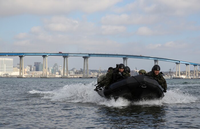 Soldiers with the Japan Ground Self-Defense Force make their way to Seal Beach on a combat rubber reconnaissance craft while conducting Helo Cast training during Exercise Iron Fist 2014 aboard Naval Amphibious Base Coronado, Calif., Jan. 27, 2014. Iron Fist is an amphibious exercise that brings together Marines and sailors from the 15th Marine Expeditionary Unit, other I Marine Expeditionary Force units, and soldiers from the JGSDF, to promote military interoperability and hone individual and small-unit skills through challenging, complex and realistic training. (U.S. Marine Corps photo by Cpl. Emmanuel Ramos/Released)