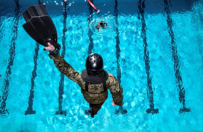 A soldier with the Japan Ground Self-Defense Force conducts helo cast training with 1st Reconnaissance Battalion during Exercise Iron Fist 2014 aboard Camp Pendleton, Calif., Jan. 23, 2014. Iron Fist is an amphibious exercise that brings together Marines and sailors from the 15th Marine Expeditionary Unit, other I Marine Expeditionary Force units, and soldiers from the JGSDF, to promote military interoperability and hone individual and small-unit skills through challenging, complex and realistic training. (U.S. Marine Corps photo by Cpl. Emmanuel Ramos/Released)