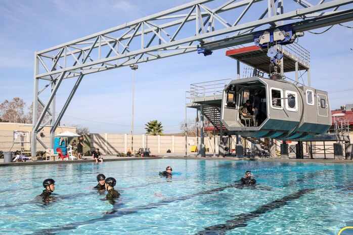Soldiers with the Japan Ground Self-Defense Force prepare to be submerged in a Modular Amphibious Egress Trainer while conducting Underwater Egress training during Exercise Iron Fist 2014 aboard Camp Pendleton, Calif., Jan. 23, 2014. Iron Fist is an amphibious exercise that brings together Marines and sailors from the 15th Marine Expeditionary Unit, other I Marine Expeditionary Force units, and soldiers from the JGSDF, to promote military interoperability and hone individual and small-unit skills through challenging, complex and realistic training. (U.S. Marine Corps photo by Cpl. Emmanuel Ramos/Released)
