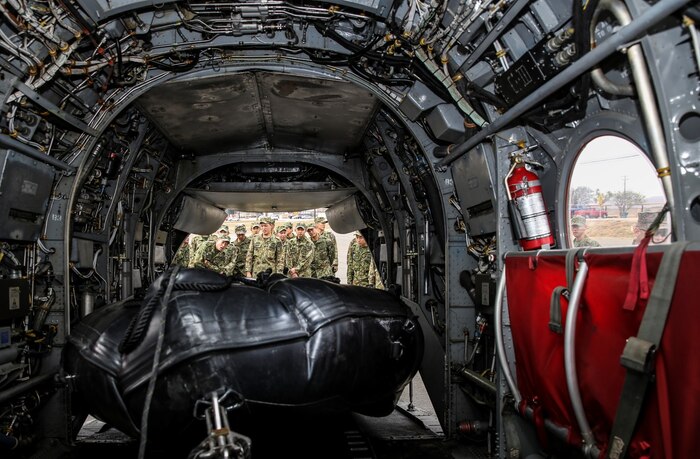 Soldiers with the Japan Ground Self-Defense Force examine how to properly load and fasten a combat rubber reconnaissance craft using the “Soft Duck” method while conducting Helo Cast training during Exercise Iron Fist 2014 aboard Camp Pendleton, Calif., Jan. 24, 2014. Iron Fist is an amphibious exercise that brings together Marines and sailors from the 15th Marine Expeditionary Unit, other I Marine Expeditionary Force units, and soldiers from the JGSDF, to promote military interoperability and hone individual and small-unit skills through challenging, complex and realistic training. (U.S. Marine Corps photo by Cpl. Emmanuel Ramos/Released)