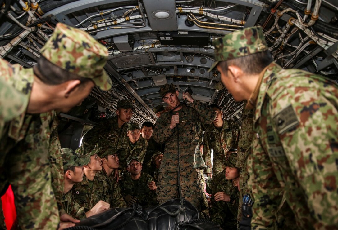 U.S. Marine Sgt. David Johnson, 1st Reconnaissance Battalion, 1st Marine Division, demonstrates how to fasten a combat rubber reconnaissance craft using the “Soft Duck” method to soldiers with the Japan Ground Self-Defense Force during Exercise Iron Fist 2014 aboard Camp Pendleton, Calif., Jan. 24, 2014. Iron Fist is an amphibious exercise that brings together Marines and sailors from the 15th Marine Expeditionary Unit, other I Marine Expeditionary Force units, and soldiers from the JGSDF, to promote military interoperability and hone individual and small-unit skills through challenging, complex and realistic training. (U.S. Marine Corps photo by Cpl. Emmanuel Ramos/Released)