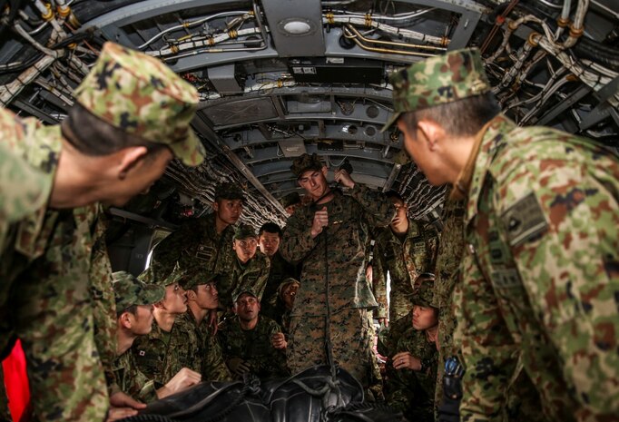 U.S. Marine Sgt. David Johnson, 1st Reconnaissance Battalion, 1st Marine Division, demonstrates how to fasten a combat rubber reconnaissance craft using the “Soft Duck” method to soldiers with the Japan Ground Self-Defense Force during Exercise Iron Fist 2014 aboard Camp Pendleton, Calif., Jan. 24, 2014. Iron Fist is an amphibious exercise that brings together Marines and sailors from the 15th Marine Expeditionary Unit, other I Marine Expeditionary Force units, and soldiers from the JGSDF, to promote military interoperability and hone individual and small-unit skills through challenging, complex and realistic training. (U.S. Marine Corps photo by Cpl. Emmanuel Ramos/Released)