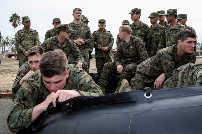 U.S. Marines with 1st Reconnaissance Battalion, 1st Marine Division, demonstrate how to execute an amphibious insertion using a combat rubber reconnaissance craft to soldiers with the Japan Ground Self-Defense Force during Exercise Iron Fist 2014 aboard Camp Pendleton, Calif., Jan. 24, 2014. Iron Fist is an amphibious exercise that brings together Marines and sailors from the 15th Marine Expeditionary Unit, other I Marine Expeditionary Force units, and soldiers from the JGSDF, to promote military interoperability and hone individual and small-unit skills through challenging, complex and realistic training. (U.S. Marine Corps photo by Cpl. Emmanuel Ramos/Released)