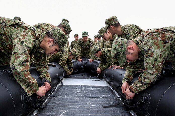 Soldiers with the Japan Ground Self-Defense Force practice rigging rope on a combat rubber reconnaissance craft while conducting Helo Cast training during Exercise Iron Fist 2014 aboard Camp Pendleton, Calif., Jan. 24, 2014. Iron Fist is an amphibious exercise that brings together Marines and sailors from the 15th Marine Expeditionary Unit, other I Marine Expeditionary Force units, and soldiers from the JGSDF, to promote military interoperability and hone individual and small-unit skills through challenging, complex and realistic training. (U.S. Marine Corps photo by Cpl. Emmanuel Ramos/Released)