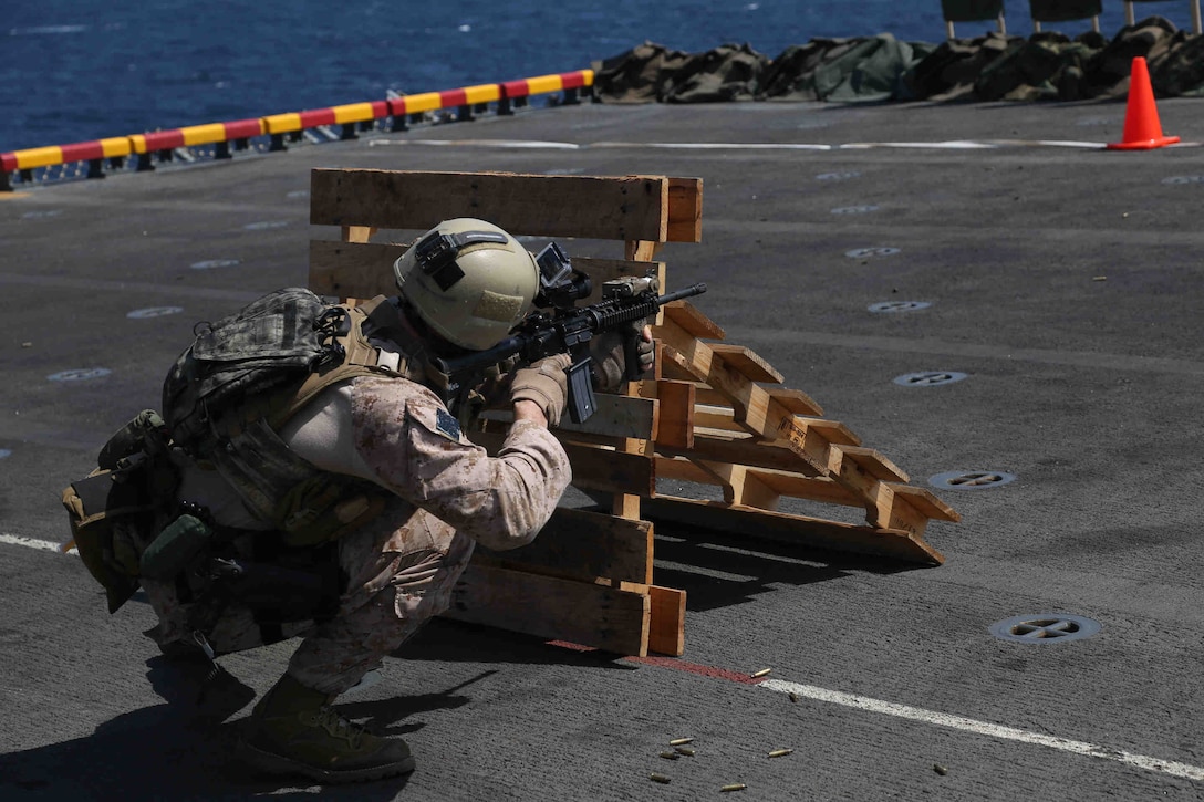 ARABIAN GULF (Jan. 28, 2014) U.S. Marines assigned to Reconnaissance Platoon, Battalion Landing Team 1st battalion, 4th Marines, 13th Marine Expeditionary Unit (MEU), conduct a barricade live fire training aboard the USS Boxer (LHD 4) at sea Jan. 28, 2014. The 13th MEU is deployed with the Boxer Amphibious Ready Group as a theater reserve and crisis response force throughout the U.S. 5th Fleet area of responsibility. (U.S. Marine Corps photo by Gunnery Sgt. Ajiboye Magbagbeola, 13th Marine Expeditionary Unit Combat Camera/Released)