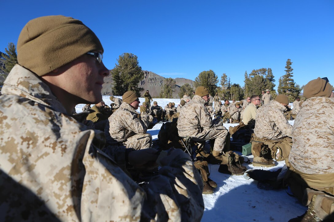 Marines and sailors with Ragnarok Company, 2nd Supply Battalion, 2nd Marine Logistics Group listen to a class about establishing bivouacs in cold-weather environments aboard the Mountain Warfare Training Center in Bridgeport, Calif., Jan. 20, 2014. Ragnarok Co. was encamped at a training area at approximately 10,000 feet above sea level for a week while training in preparation for Cold Response 2014, a NATO exercise in Norway. 