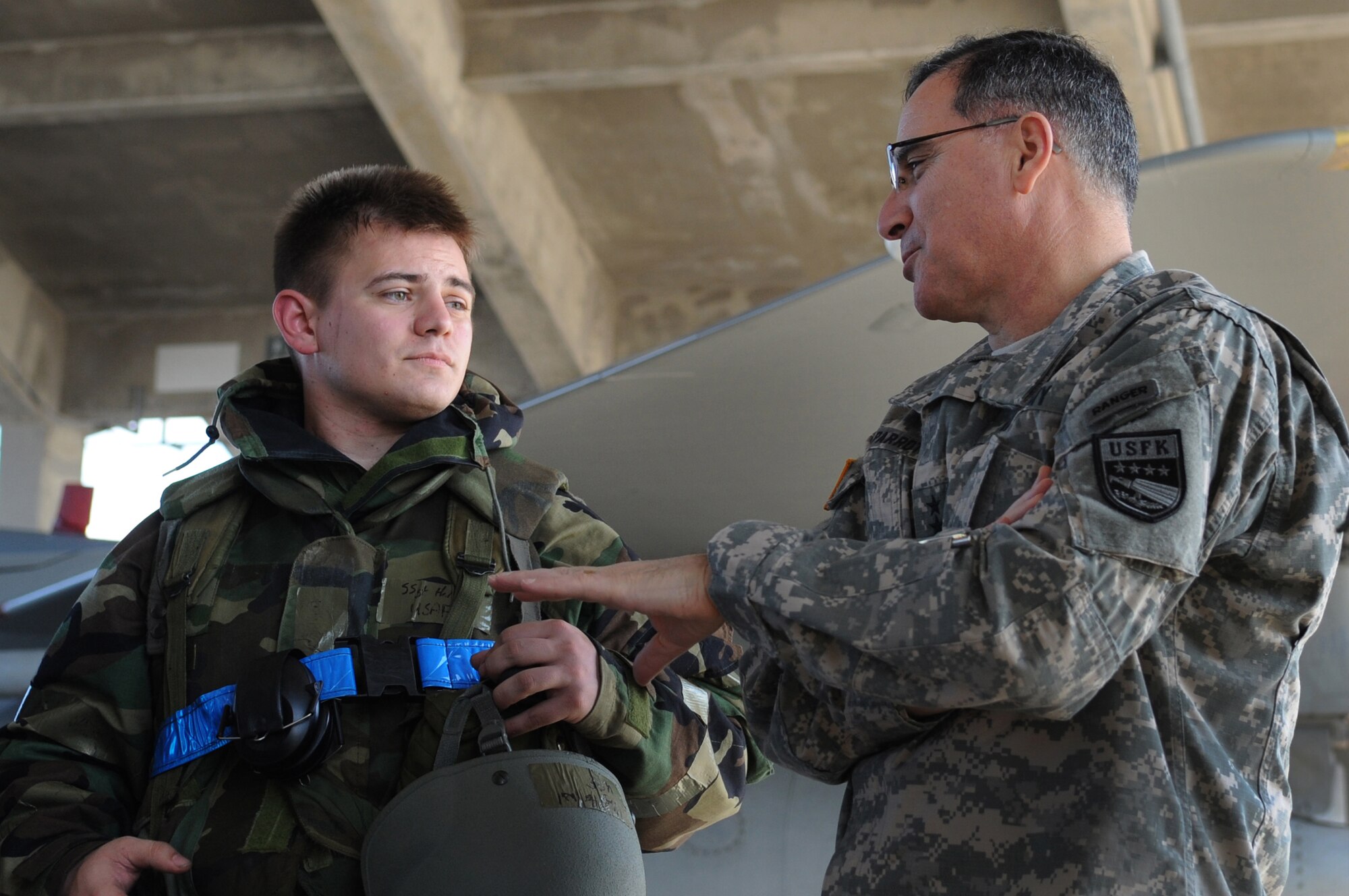 U.S. Army Gen. Curtis Scaparrotti, United States Forces Korea commander, speaks with U.S. Air Force Staff Sgt. Wil Hart, 18th Aircraft Maintenance Squadron weapons load crew team chief, during a visit to Kadena Air Base, Japan, Jan. 30, 2014. This visit marks Scaparrotti?s first visit to Kadena since taking command of USFK in October 2013. Scaparrotti, toured the 18th Wing and spoke with Airmen about the importance of their mission to USFK. (U.S. Air Force photo by Staff Sgt. Amber E. N. Jacobs)