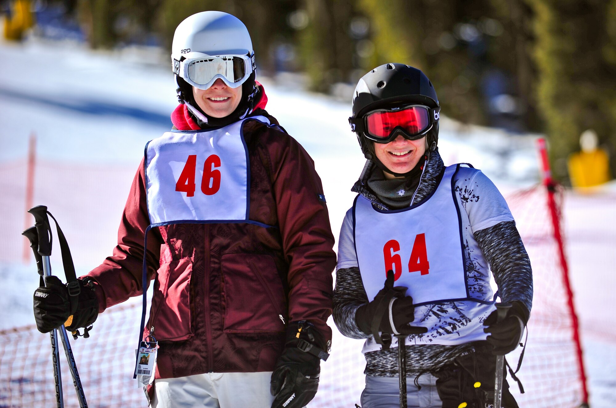 Air Force Reservists Master Sgt. Carli Friss and Capt. April Harker pose for a photo January 25 during SnoFest at Keystone, Colo. Both Friss and Harker, members of the 310th Space Wing headquartered at Schriever Air Force Base, Colo., competed in timed team ski events, representing the 310th SW. SnoFest is an annual winter event hosted by the Colorado front range military bases that features skiing, snowboarding, lodging, parties, giveaways, races and non-skiing events for the military community, to include active duty, Department of Defense civilians, family members and retirees. (U.S. Air Force photo/Tech. Sgt. Nicholas B. Ontiveros)