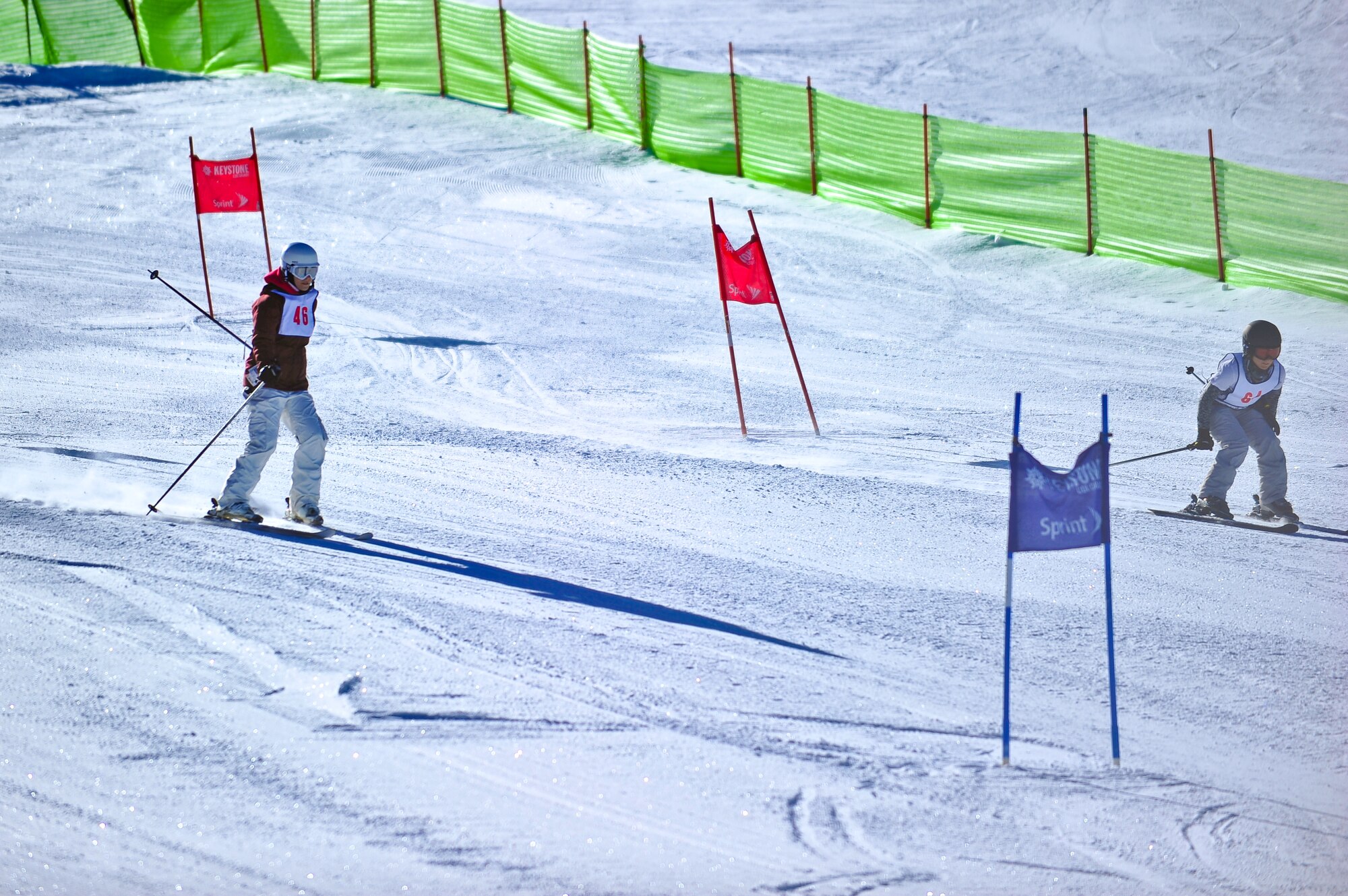 Air Force Reservists Master Sgt. Carli Friss and Capt. April Harker ski a timed race course January 25 during SnoFest at Keystone, Colo. Both Friss and Harker are members of the 310th Space Wing headquartered at Schriever Air Force Base, Colo. SnoFest is an annual winter event hosted by the Colorado front range military bases that features skiing, snowboarding, lodging, parties, giveaways, races, non skiing events for the military community, to include active duty, Department of Defense civilians, family members and retirees. (U.S. Air Force photo/Tech. Sgt. Nicholas B. Ontiveros)