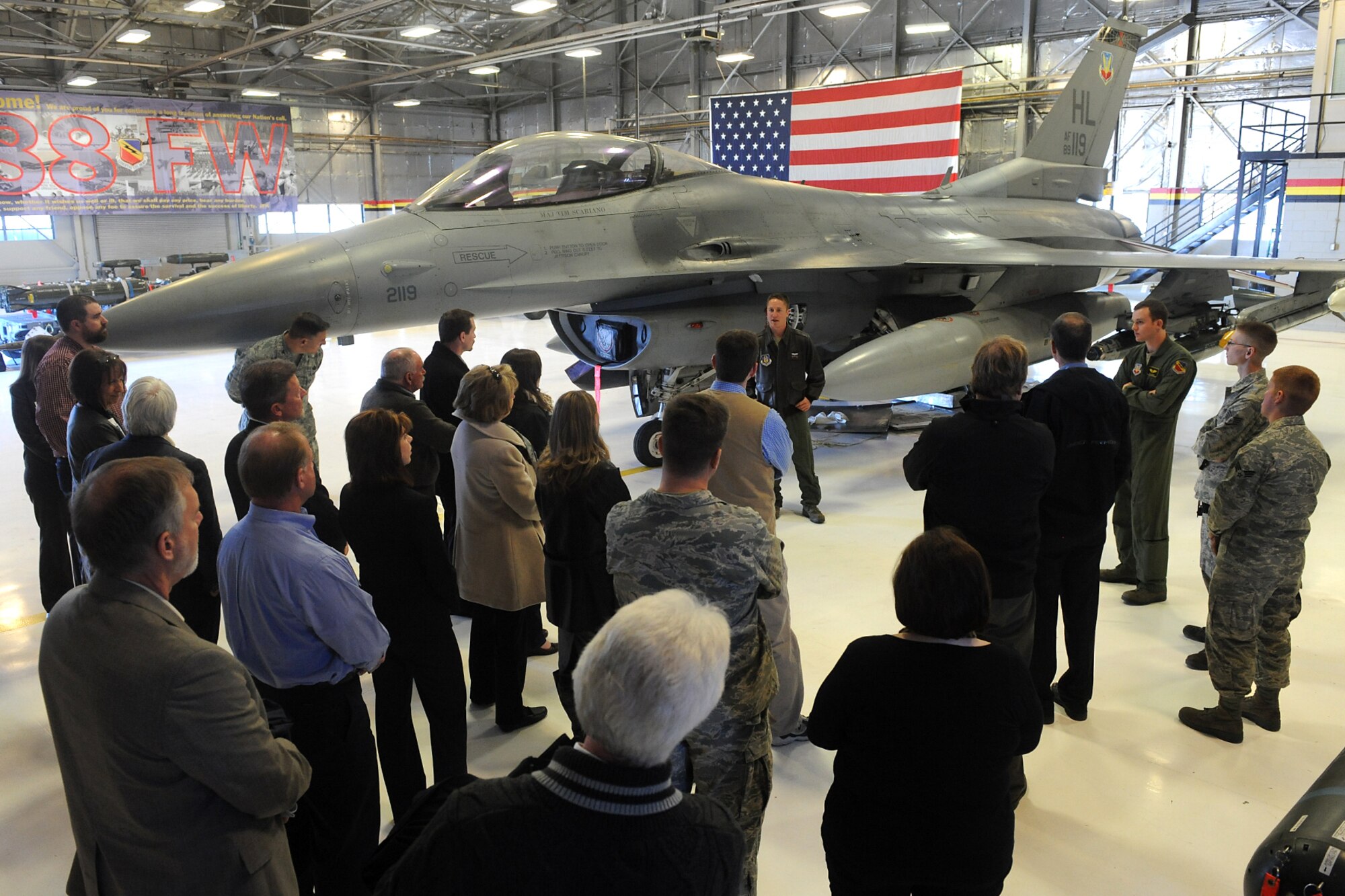 Honorary Commanders learn about the capability of an F-16 Fighting Falcon. Community members and business leaders were appointed Team Hill Honorary Commanders during an induction ceremony at Hill Air Force Base Jan. 23. The honorarys embarked on an interactive tour of the Ogden Air Logistics Complex, the 388th and 419th Fighter Wings and the 75th Air Base Wing. (U.S. Air Force photo by Alex R. Lloyd)
