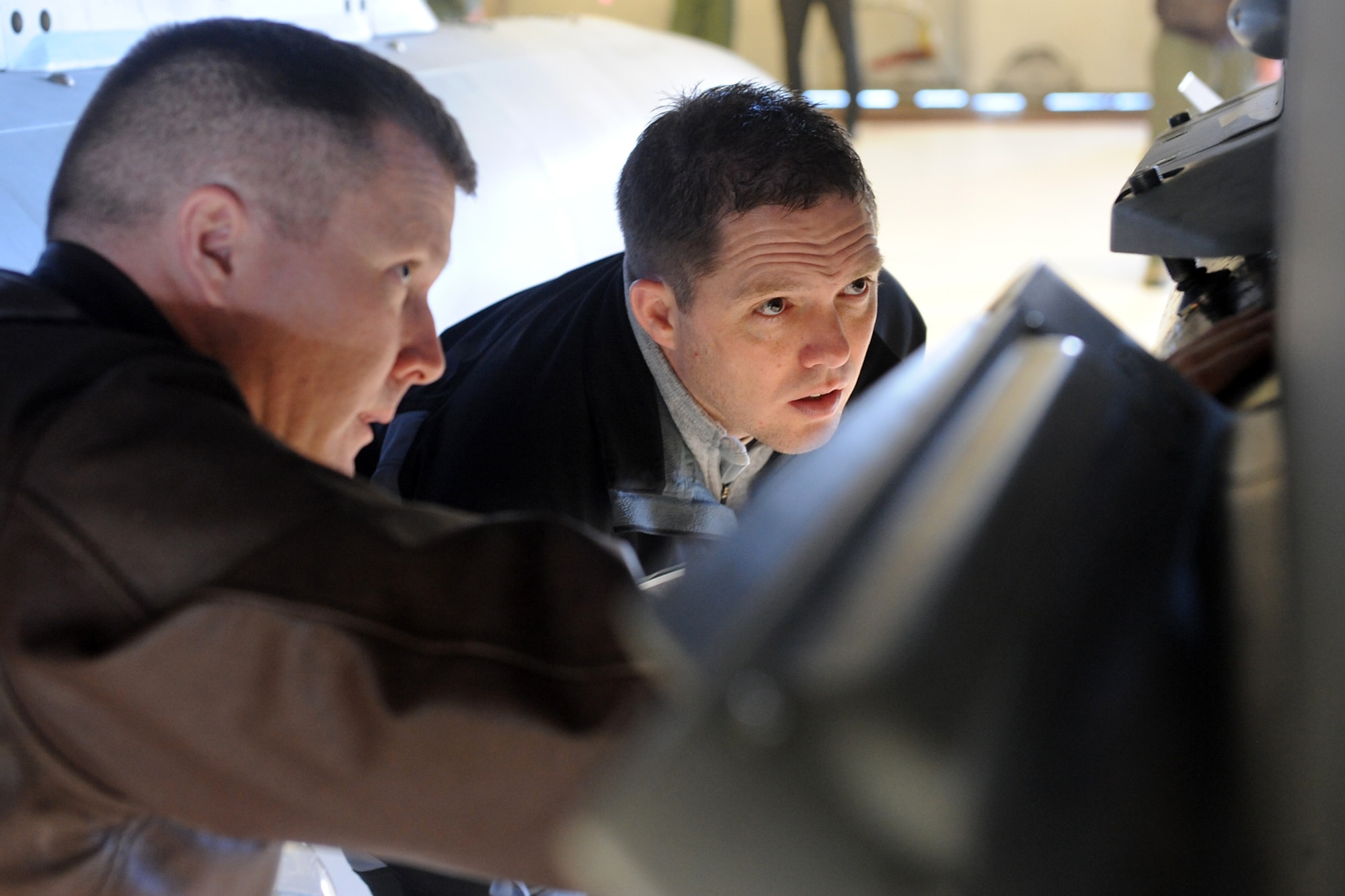 Col. Todd Dozier (left), 388th Fighter Wing vice commander, explains an F-16 Fighting Falcon's weapon capability with honorary and Kaysville City Mayor Steve Hiatt. Community members and business leaders were appointed Team Hill Honorary Commanders during an induction ceremony at Hill Air Force Base Jan. 23.  (U.S. Air Force photo by Alex R. Lloyd)
