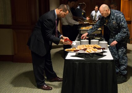 Attendees choose from a variety of breakfast items Jan. 23, 2014 during a meeting between Airmen from the 628th Security Forces Squadron and local police agencies. meeting at the Charleston Club on Joint Base Charleston – S.C. The intent of the meeting was to strengthen relationships between the local agencies and to improve teamwork. (U.S. Air Force photo by Airman 1st Class Clayton Cupit) 