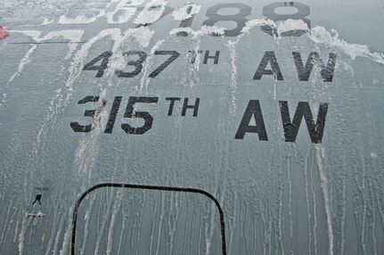 An Ice covered C-17 Globemaster III gets de-iced by the 437th Maintenance Group Jan. 30, 2014, as operations resume at Joint Base Charleston – Air Base following an ice storm. The plane was being de-iced in preparation for a mission later in the day. (U.S. Air Force photo/Staff Sgt. William O’Brien)