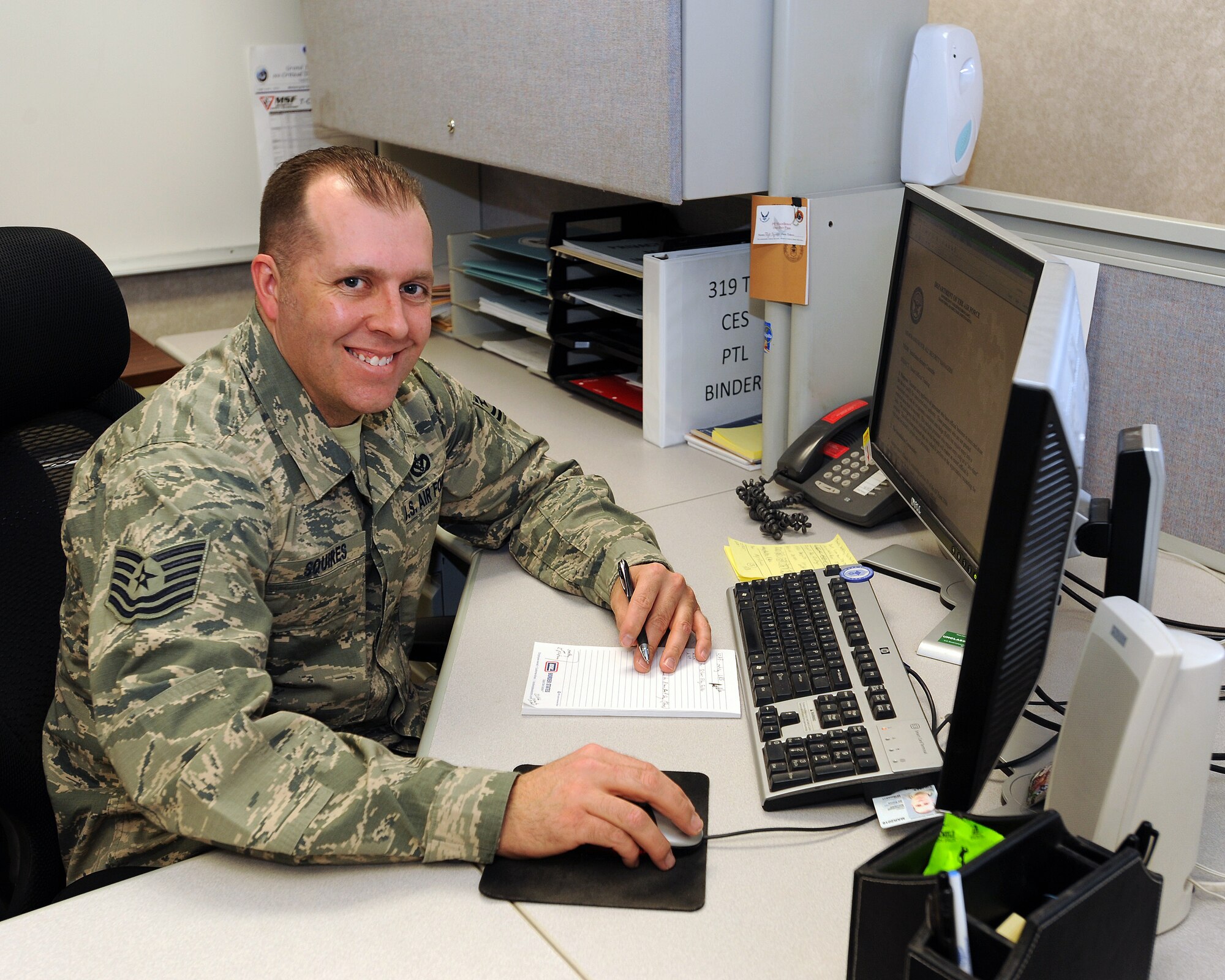 Tech. Sgt. Shawn Squires, 319th Civil Engineer Squadron, unit security and safety manager, checks his e-mail Jan. 29, 2014 on Grand Forks Air Force Base, N.D. The 16-year Air Force veteran from Gilroy, Calif., was named the Grand Forks Air Force Base, N.D.’s, Warrior of the Week for the fourth week of January 2014. (U.S. Air Force photo/Airman 1st Class Zachiah Roberson)