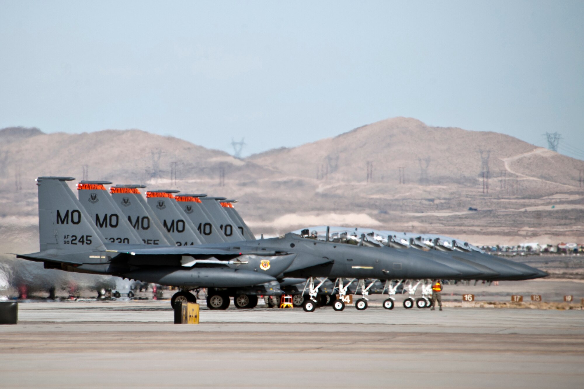 Seven F-15E Strike Eagles assigned to the 391st Fighter Squadron, Mountain Home Air Force Base, Idaho, taxi into position for an end-of-runway inspection prior to a Red Flag 14-1 training mission Jan. 29, 2014, at Nellis AFB Nev. Air force units from the around the country and the world have come to Nellis to work together on simulated combat scenarios to prepare them for future real-world conflicts or war. (U.S. Air Force photo by Lorenz Crespo)