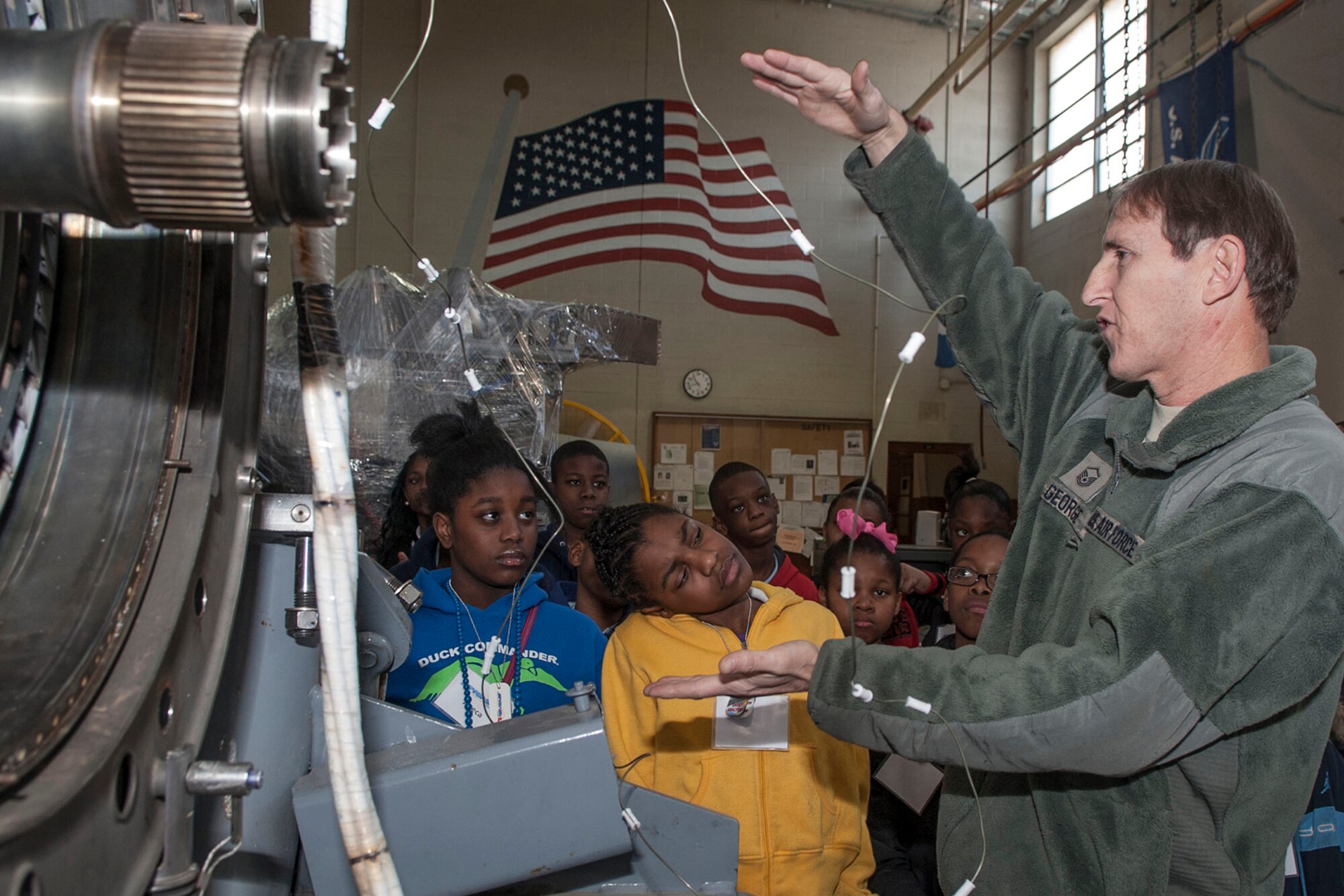 U.S. Air Force Master Sgt. William George, TF-34 section supervisor, 442nd Maintenance Squadron – Outside Location Assignment (MXS-OLA) unit, explains the TF34 jet engine, which is a military turbofan engine, used on the A-10 Thunderbolt II, to a group of 5th Grade students from Southern Hills Elementary, who are attending STARBASE Louisiana at Barksdale Air Force Base, La, Jan. 29, 2014. STARBASE Louisiana is one of over 70 national STARBASE sites and is sponsored by the 307th Bomb Wing. (U.S. Air Force photo by Master Sgt. Jeff Walston/Released) 