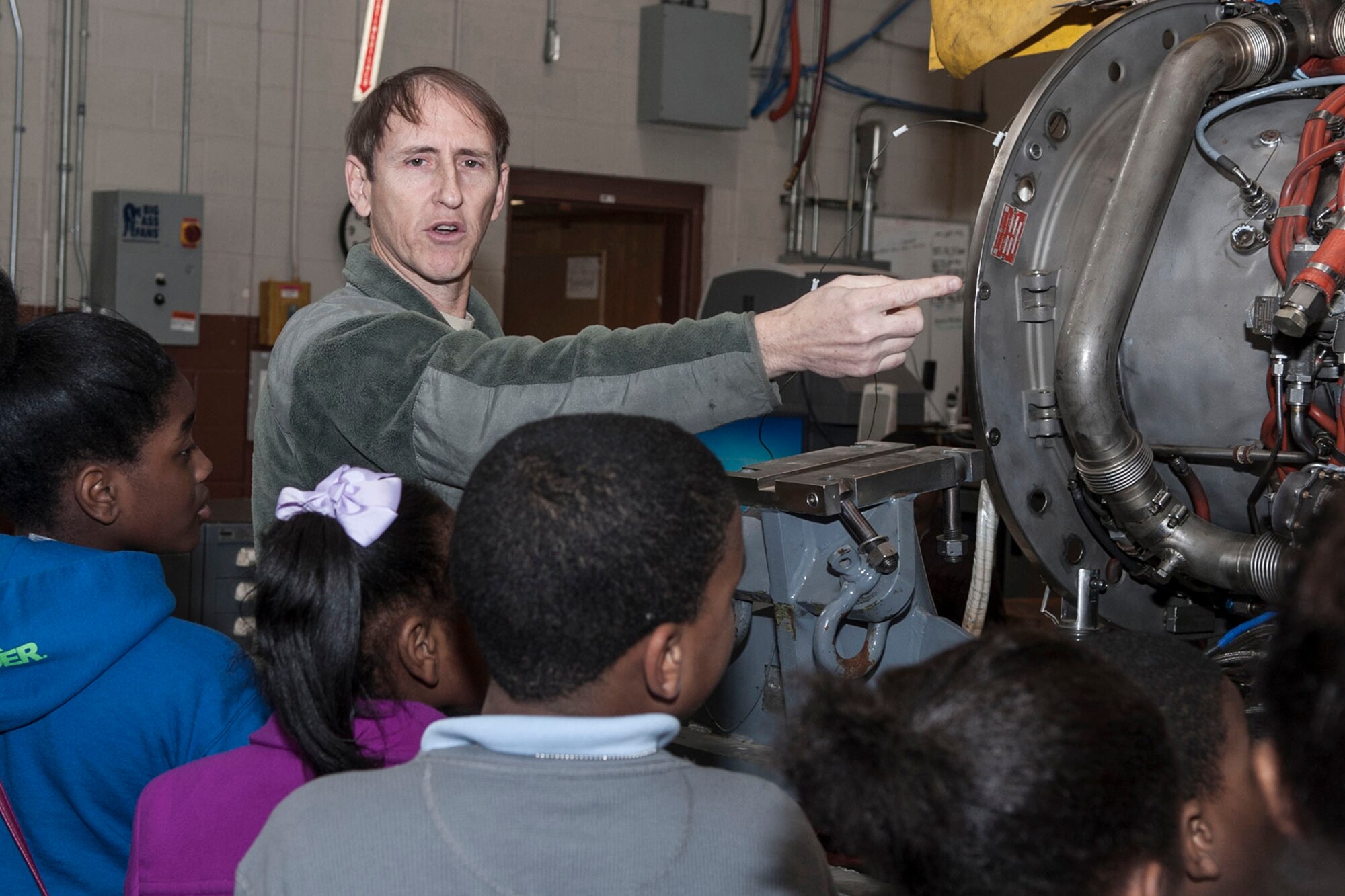U.S. Air Force Master Sgt. William George, TF-34 section supervisor, 442nd Maintenance Squadron – Outside Location Assignment (MXS-OLA) unit, explains the TF34 jet engine, which is a military turbofan engine, used on the A-10 Thunderbolt II, to a group of 5th Grade students from Southern Hills Elementary, who are attending STARBASE Louisiana at Barksdale Air Force Base, La, Jan. 29, 2014. STARBASE presents an exciting 25-hour hands-on minds-on Science, Technology, Engineering, and Mathematics (STEM) curriculum to area 5th grade students and their teachers. (U.S. Air Force photo by Master Sgt. Jeff Walston/Released) 