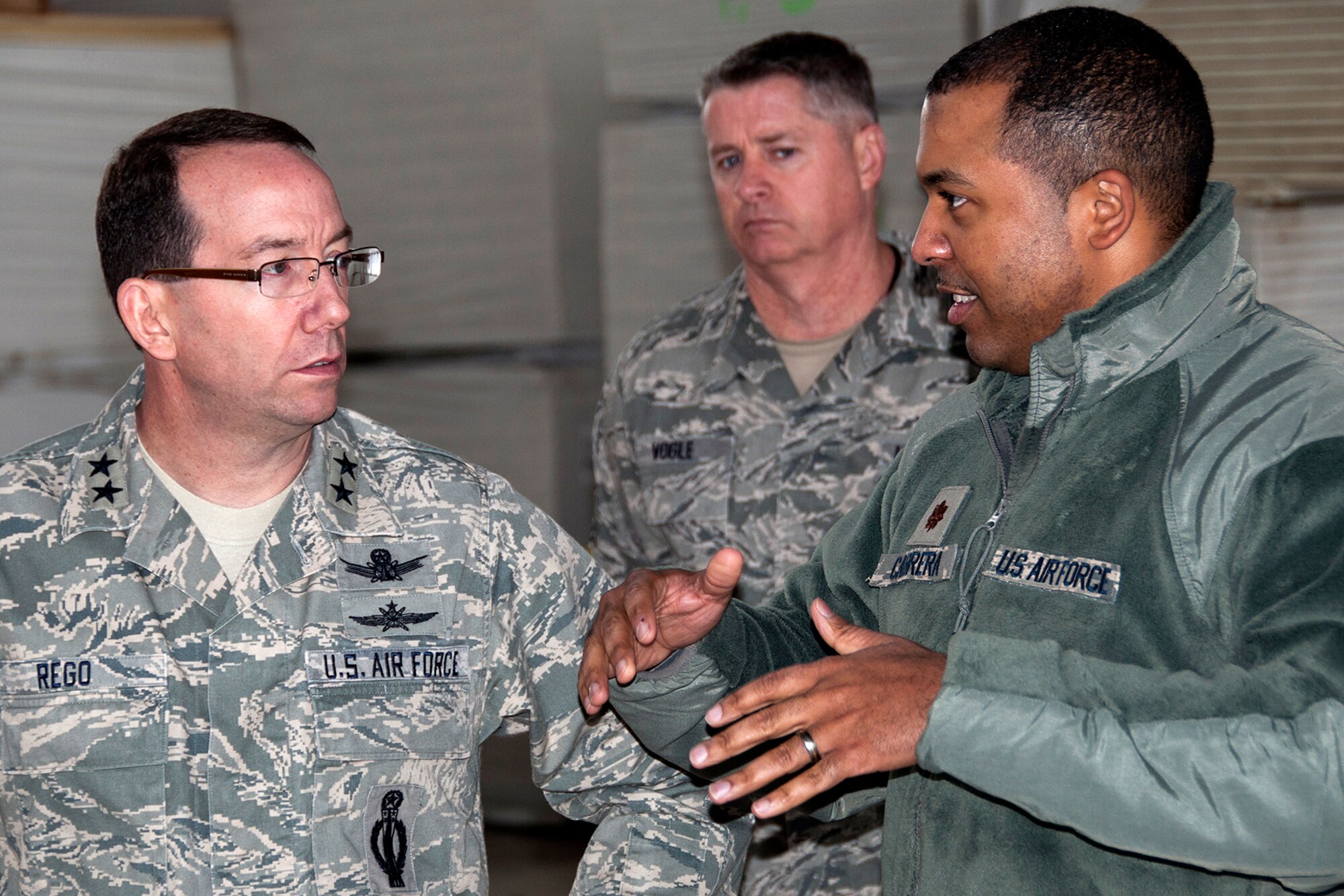 U.S. Air Force Maj. Steven Cabrera, 307th Aircraft Maintenance Squadron commander, talks with Maj. Gen. Robert Rego during a tour of the squadron, Jan. 26, 2014, Barksdale Air Force Base, La. Rego, the Air Force Global Strike Command vice commander, visited the 307th Bomb Wing to meet with Airmen and learn more about the wing's various missions. (U.S. Air Force photo by Tech. Sgt. Theodore Daigle/Released)