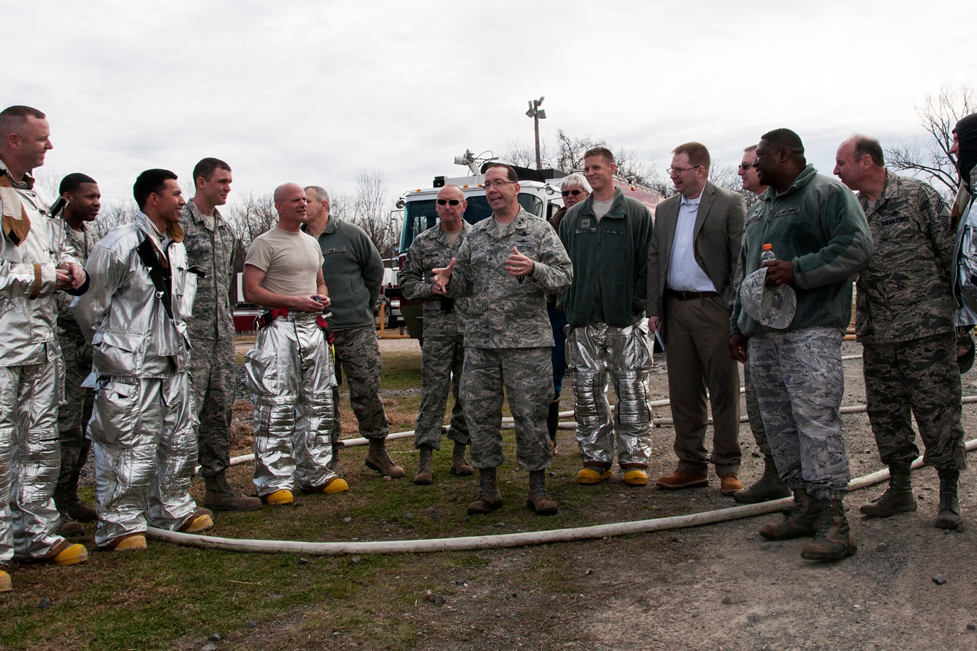 U.S. Air Force Maj. Gen. Robert Rego talks to a group of 307th Civil Engineer Squadron firefighters after participating in extinguishing a fire in simulated large frame aircraft, Jan. 26, 2014, Barksdale Air Force Base, La. Rego, the Air Force Global Strike Command vice commander, visited the squadron during their annual firefighting certification training. (U.S. Air Force photo by Tech. Sgt. Theodore Daigle/Released)