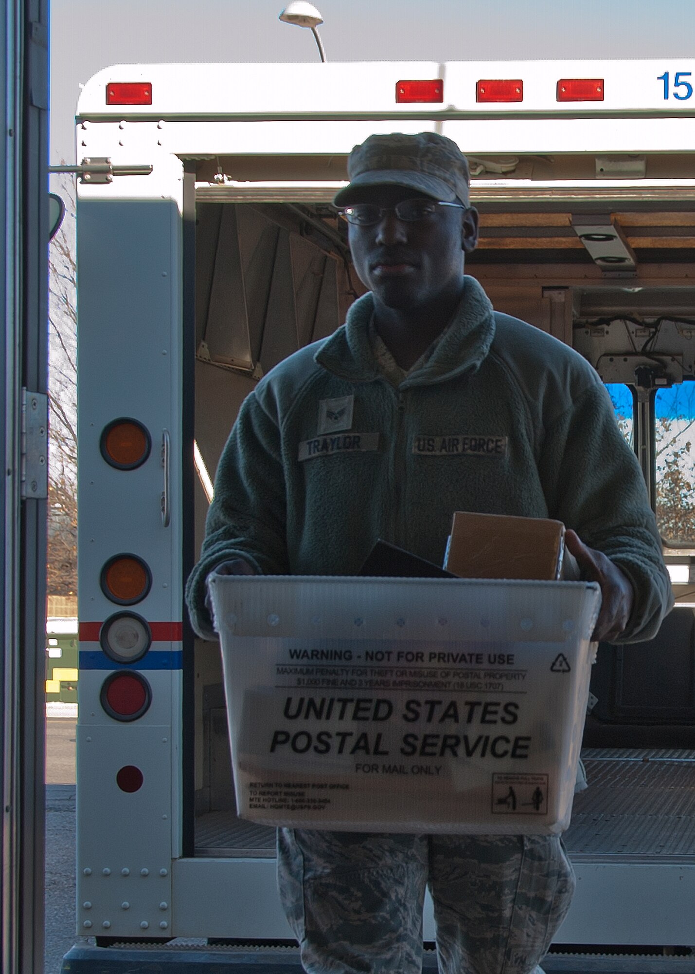 ALTUS AIR FORCE BASE, Okla. – U.S. Air Force Airman Fred Taylor, 97th Communications Squadron knowledge operations management, unloads a mail truck at the official mail center Jan. 29, 2014. Mail is delivered to the base postal service center and official mail centers Monday to Friday at 10 a.m. to be dispersed into the proper, individual mailboxes. The official mail center separates all mail sent to and from squadrons ensuring it is delivered to the correct location. (U.S. Air Force photo by Senior Airman Franklin R. Ramos/Released)
