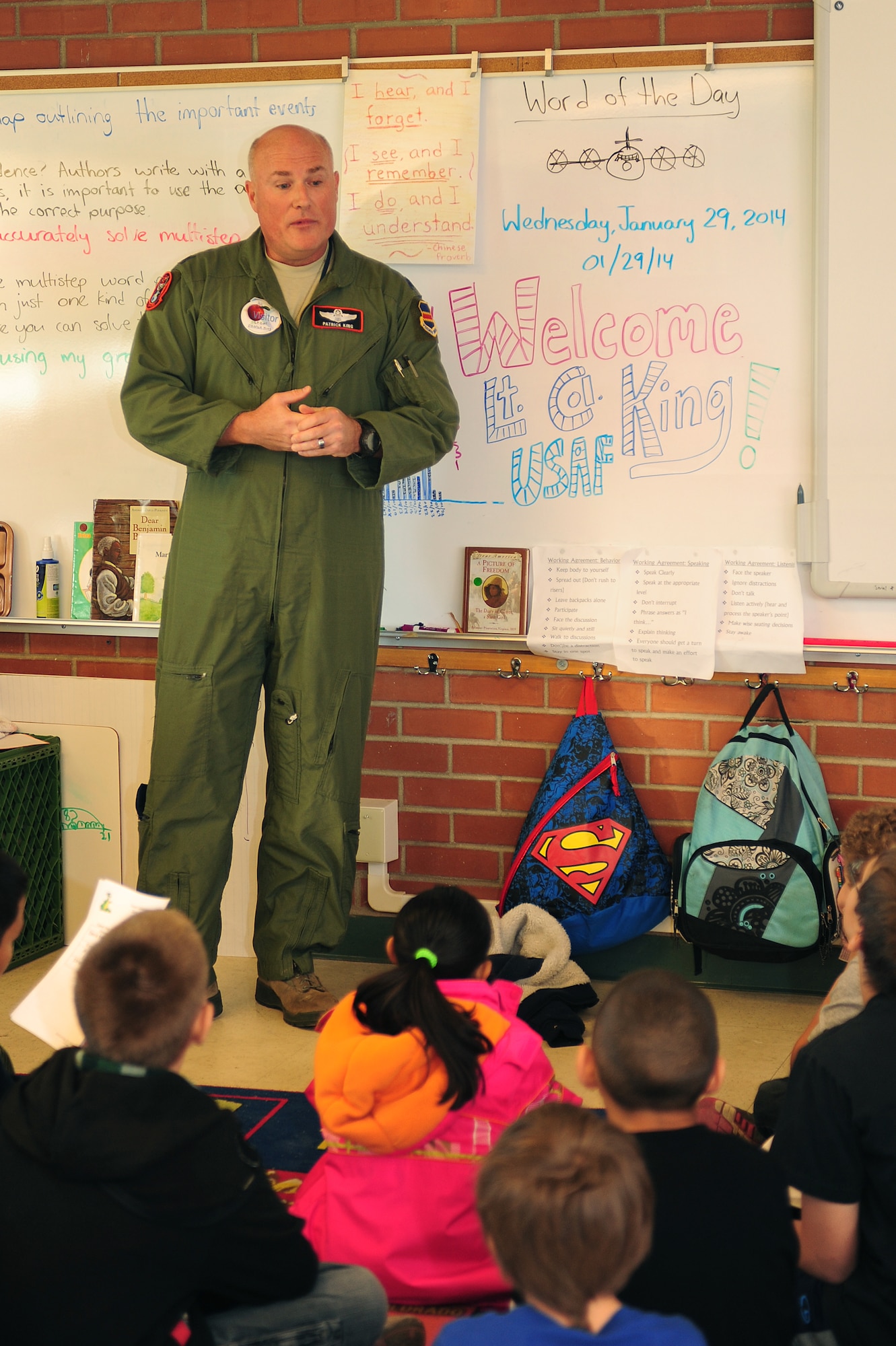 U.S. Air Force Lt. Col. Patrick King, EC-130 Compass Call pilot, educates students about being a military pilot during career day at Dietz Elementary School, Tucson, Ariz., Jan. 29, 2014. Students ranging from the first grade through the sixth grade participated in the school’s career day. (U.S. Air Force photo by Senior Airman Camilla Elizeu/Released)