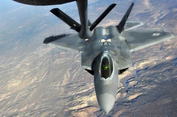 A KC-135 Stratotanker from the 93rd Air Refueling Squadron from Fairchild Air Force Base, Wash., refuels an F-22 Raptor from Joint Base Langley-Eustis, Va., during Red Flag 14-1 Jan. 28, 2014, over the Nevada Test and Training Range. Red Flag was developed by Maj. Moody Suter to simulate the first 10 combat missions pilots would face after the kill ratio declined to two to one during Vietnam during the pilots first 10 combat missions. (U.S. Air Force photo/Staff Sgt. Veronica Montes/Released)