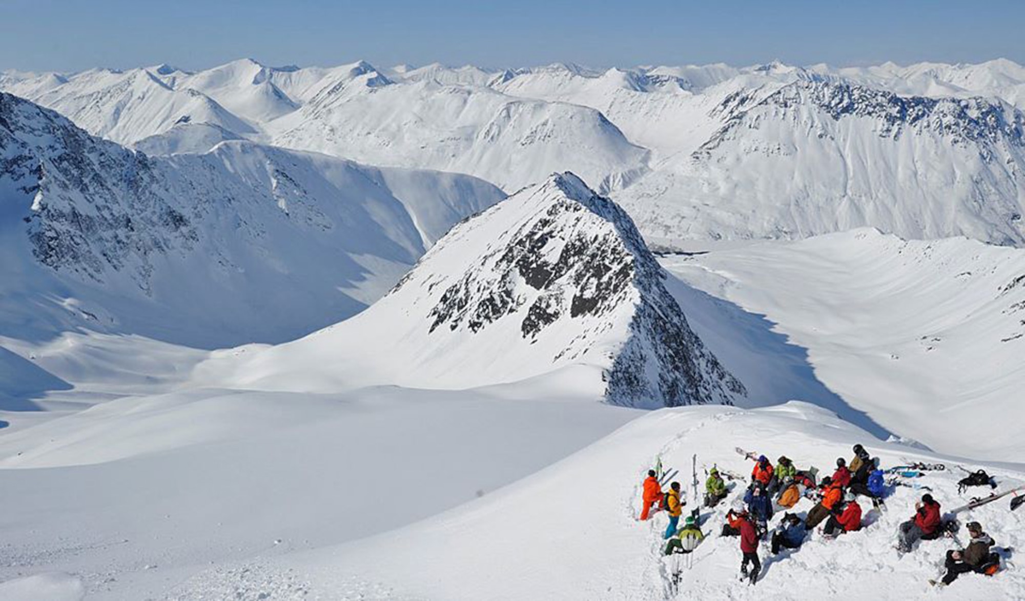 Service members look out on the rest of the Chugach mountain range from the top of Mount Alyeska, on a trip sponsored by the Single Airman Program. (Courtesy Photo)