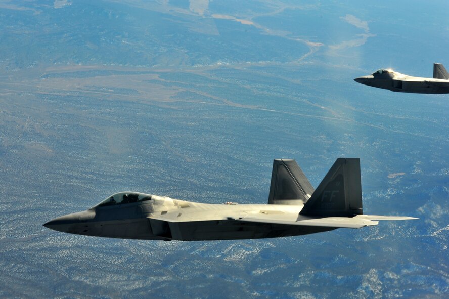 An F-22 Raptor from Joint Base Langley-Eustis, Va., pulls away from a KC-135 Stratotanker from the 93rd Air Refueling Squadron from Fairchild Air Force Base, Wash., after tanking up during Red Flag 14-1 Jan. 28, 2014, over the Nevada Test and Training Range. More than 440,000 service members have participated in Red Flag since 1975, including more than 145,000 aircrew member flying more than 385,000 sorties and logging more than 660,000 flight hours. (U.S. Air Force photo/Staff Sgt. Veronica Montes/Released)