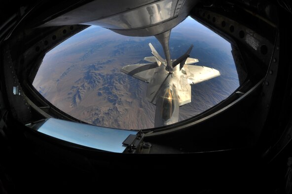 A KC-135 Stratotanker from the 93rd Air Refueling Squadron from Fairchild, Wash., refuels an F-22 Raptor from Joint Base Langley-Eustis, Va., during Red Flag 14-1 Jan. 28, 2014, over the Nevada Test and Training Range. Red Flag gives aircrew and air support operations service members from various airframes, military services and allied countries an opportunity to integrate and practice combat operations. (U.S. Air Force photo/Staff Sgt. Veronica Montes/Released)