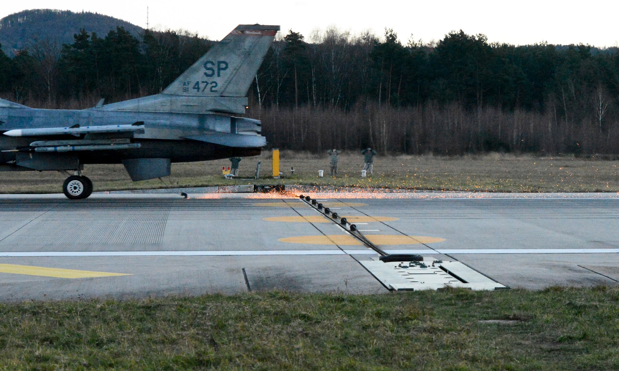 An F-16, assigned to Spangdahlem Air Base, Germany, runs through a test of a Barrier Arresting Kit-12 on the flightline Jan. 28, 2014, Ramstein Air Base, Germany. Safeguarding equipment and the lives of military personnel, the BAK-12 ensures a safe deceleration of landing aircraft within a few seconds. (U.S. Air Force Photo/Airman First Class Michael Stuart)