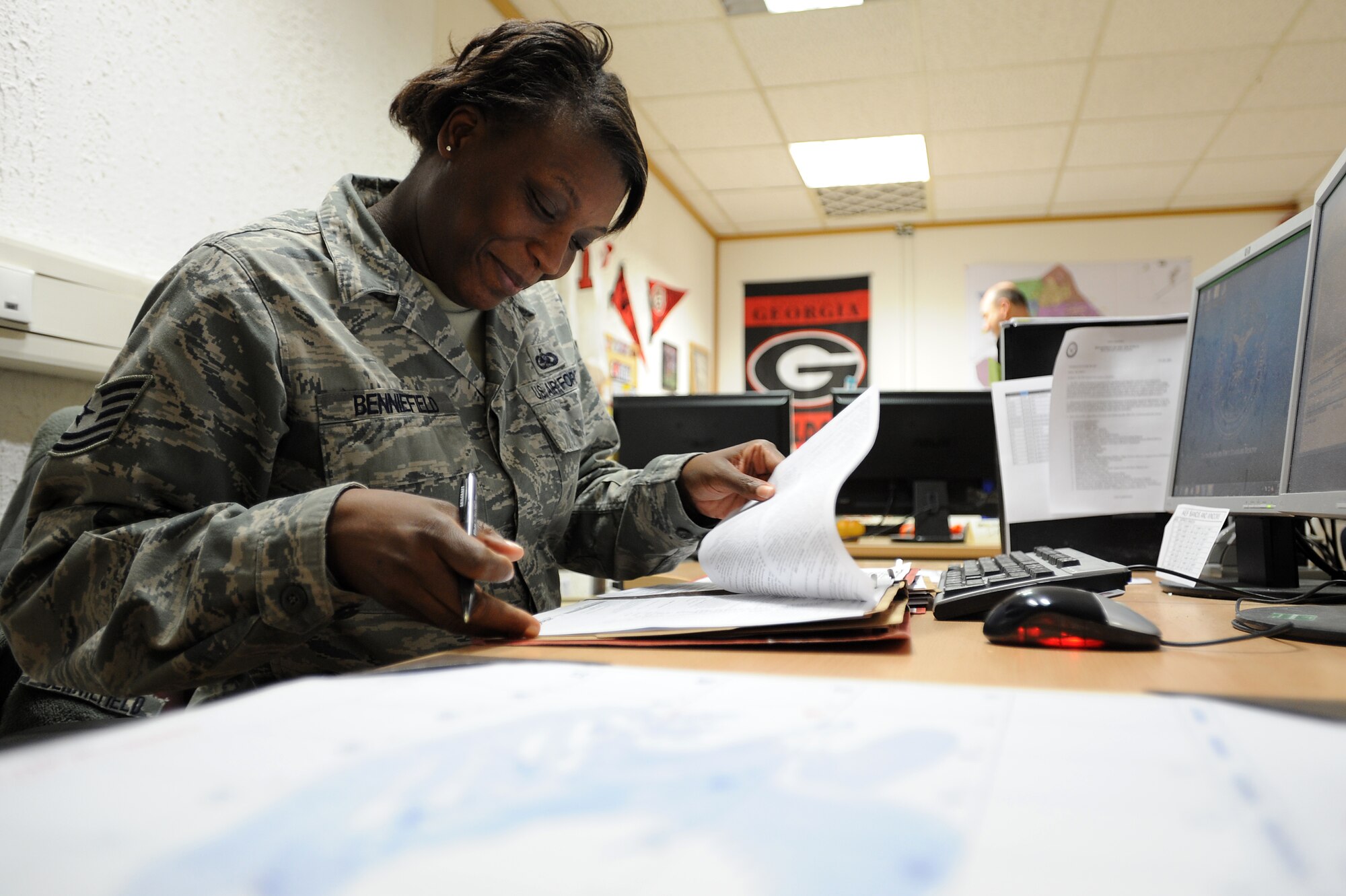 Tech Sgt. Wakanda Benniefield, 86th Logistics Readiness Squadron unit deployment manager, ensures an Airman’s paperwork matches the information on the computer Jan. 21, 2014, Ramstein Air Base, Germany. UDMs ensure their squadron has deployable, expeditionary Airmen to keep the mission going.(U.S. Air Force photo/Airman 1st Class Holly Mansfield)
