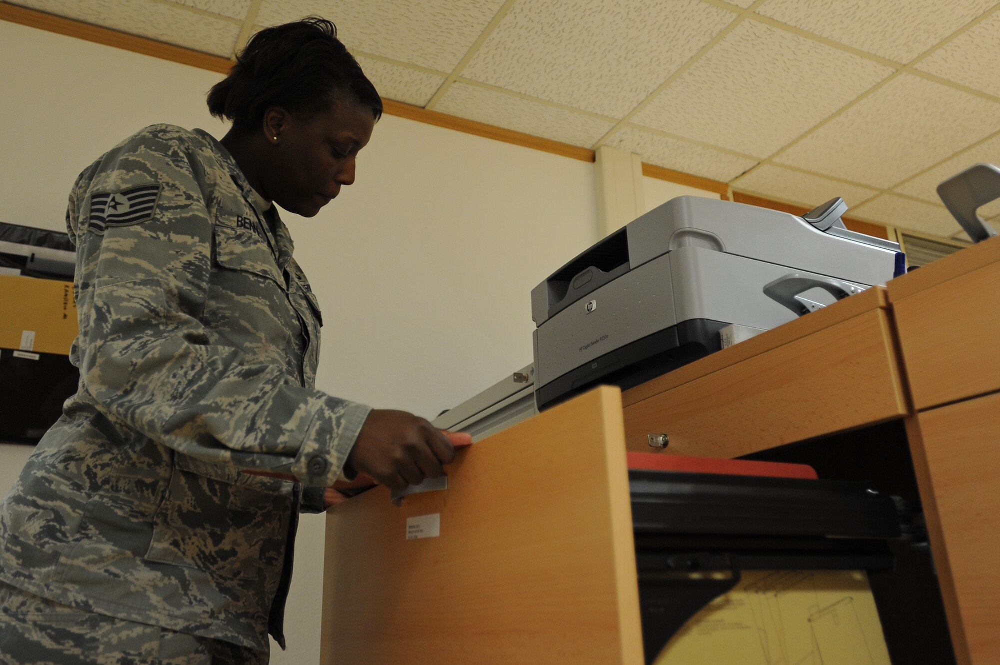 Tech Sgt. Wakanda Benniefield, 86th Logistics Readiness Squadron unit deployment manager, checks information in an Airman’s file to make sure they have all the proper training before deploying Jan. 21, 2014, Ramstein Air Base, Germany. UDMs make sure the Airmen from their squadron have all the proper paper work before deploying.(U.S. Air Force photo/Airman 1st Class Holly Mansfield)