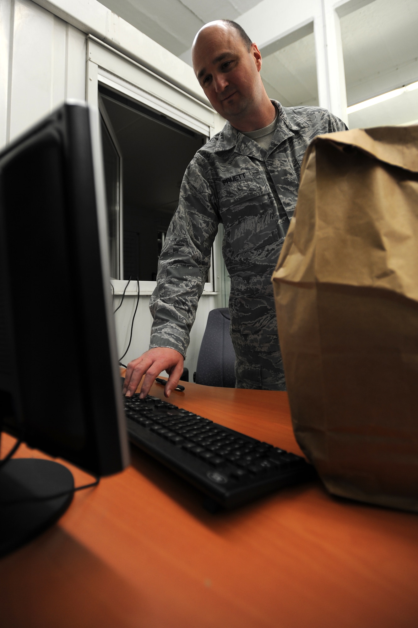 Master Sgt. Kenneth Pruett, 86th Logistics Readiness Squadron unit deployment manager, signs out equipment for a deploying LRS Airman Jan. 21, 2014, Ramstein Air Base, Germany. Ensuring Airmen have the proper training and equipment before deploying can be key to a succesful deployment.(U.S. Air Force photo/Airman 1st Class Holly Mansfield)