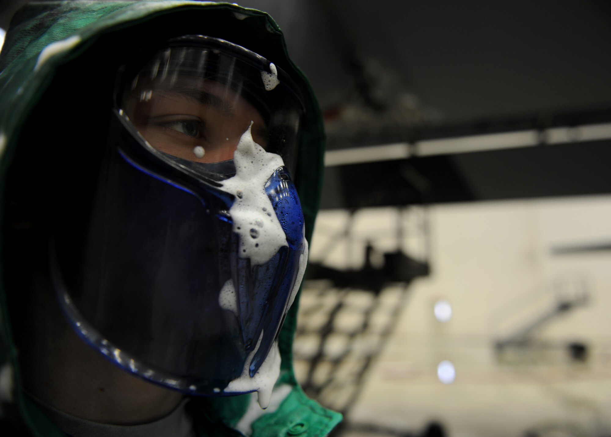 Airman 1st Class Anthony Storer, a 19th Aircraft Maintenance Squadron crew chief, washes an aircraft Jan. 23, 2014, at Little Rock Air Force Base, Ark. Personal protective equipment is important for safety in the wash rack and prevents dirt, oil, grease and aircraft equipment cleaner from getting into an Airman's eyes or on their skin. (U.S. Air Force photo by Airman 1st Class Scott Poe)