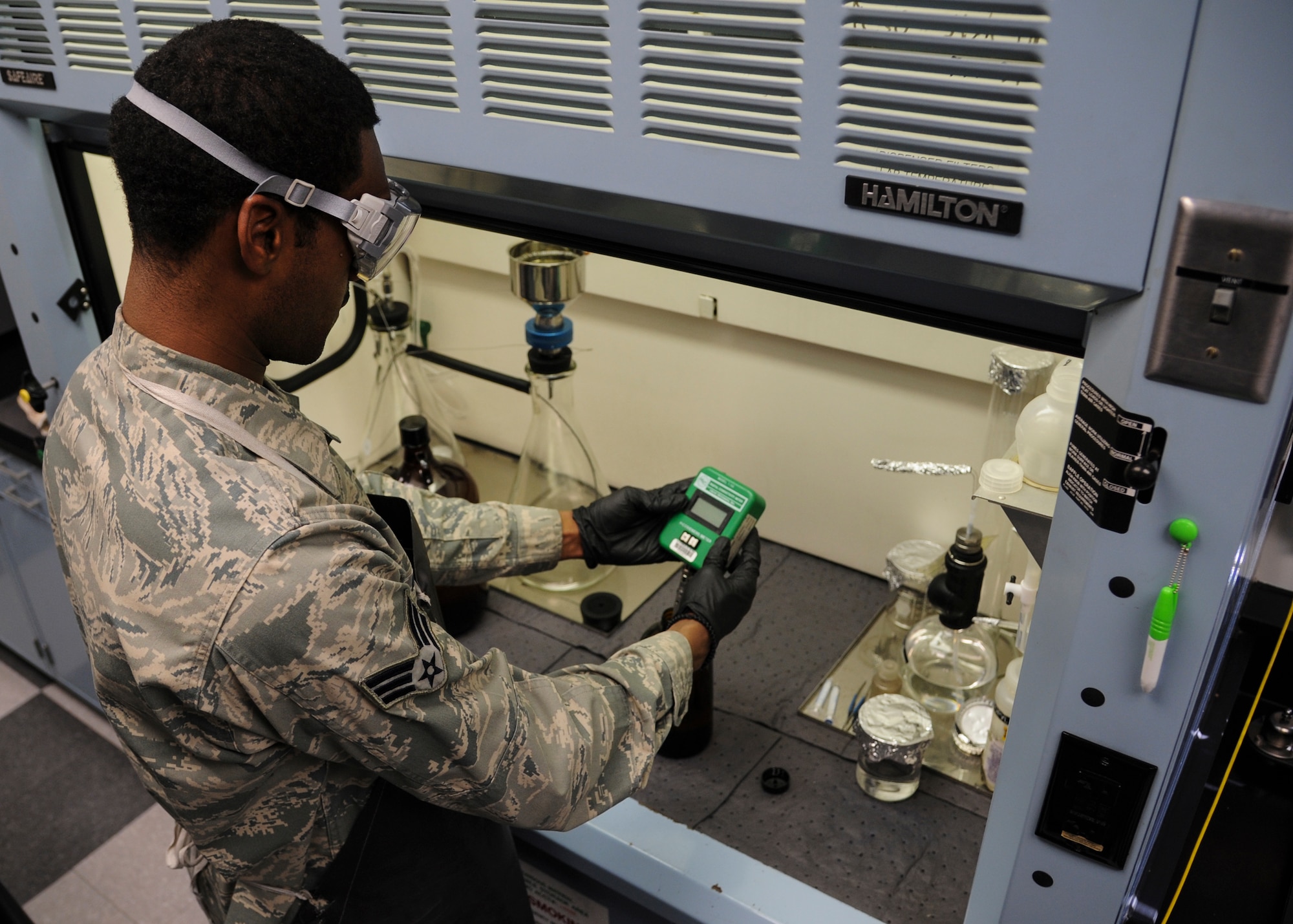 Senior Airman Norman DeJamison, a 19th Logistics Readiness Squadron fuels lab technician, tests jet fuel for proper additive levels Jan 29, 2014, at Little Rock Air Force Base, Ark. All fuel that is pumped by the fuels management flight is sampled to see if it is suitable for The Rock’s C-130s. (U.S. Air Force photo by Airman 1st Class Harry Brexel) 