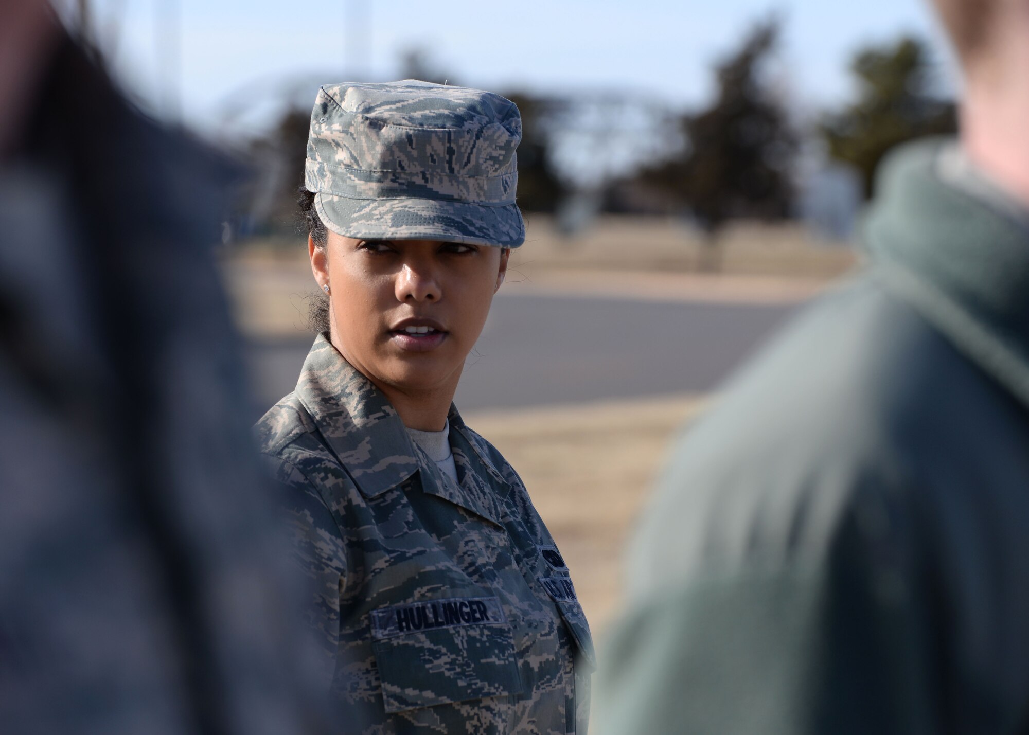 ALTUS AIR FORCE BASE, Okla. – U.S. Air Force Senior Airman Mariah Hullinger, 452nd Logistics Readiness Squadron, inspects her fellow Airmen at the Airman Leadership School parade training area Jan. 15, 2014. Hullinger traveled from March Air Reserve Base, Calif. to attend ALS. Airmen spend five weeks developing leadership abilities and learning to become effective communicators. (U.S. Air Force photo by Senior Airman Levin Boland/Released)