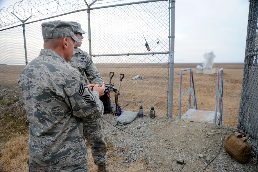 Chief Master Sgt. Jerry Lewis, chief of Enlisted Matters of the Air Force Civil Engineer, activates an explosive device for a training scenario during his visit to Kunsan Air Base, Republic of Korea, Jan. 29, 2013. Lewis toured Kunsan with Maj. Gen. Theresa C. Carter, the Air Force civil engineer, to get a hands-on view of the mission, as well as to hear Airmen’s concerns and answer questions they may have. (U.S. Air Force photo by Staff Sgt. Jessica Haas/Released)