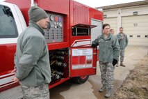 Maj. Gen. Theresa C. Carter, Air Force civil engineer, speaks to Tech. Sgt. Jarrod Williams, 8th Civil Engineer Squadron firefighter, about the new Rapid Intervention Vehicle and it’s capabilities during her visit to Kunsan Air Base, Republic of Korea, Jan. 29, 2013. Carter toured Kunsan to get a hands-on view of the mission, as well as to hear Airmen’s concerns and answer questions they may have. (U.S. Air Force photo by Staff Sgt. Jessica Haas/Released)