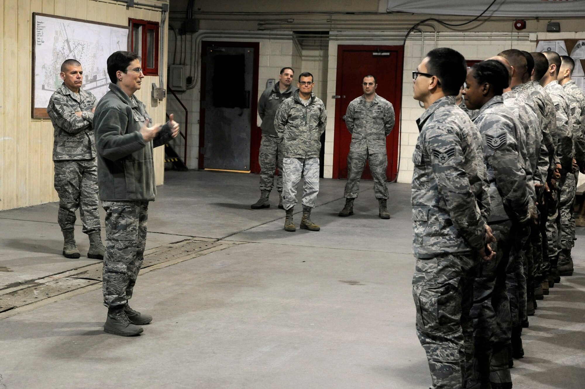 Maj. Gen. Theresa C. Carter, the Air Force civil engineer, speaks to the 8th Civil Engineer Squadron’s ‘Dirt Boys’ about their career field and upcoming changes during her visit to Kunsan Air Base, Republic of Korea, Jan. 29, 2013. Carter toured Kunsan to get a hands-on view of the mission, as well as to hear Airmen’s concerns and answer questions they may have. (U.S. Air Force photo by Staff Sgt. Jessica Haas/Released)
