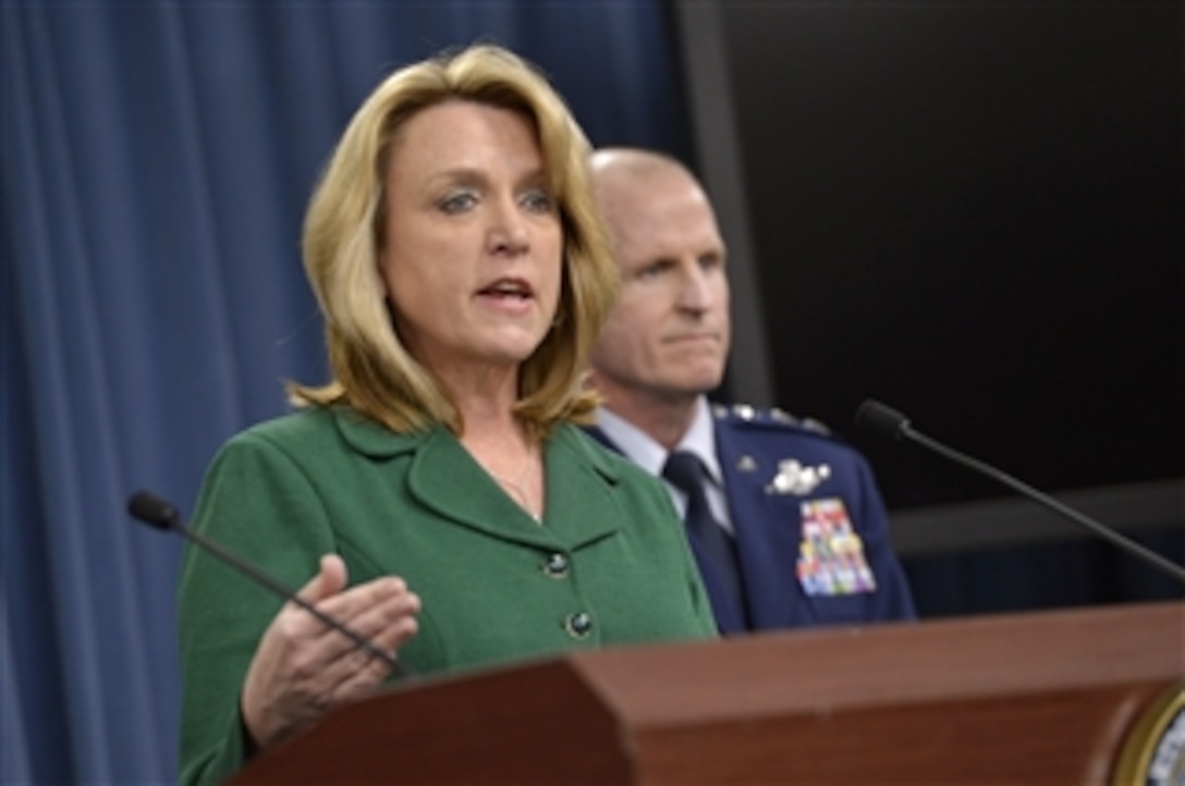 Air Force Secretary Deborah Lee James briefs reporters as Air Force Lt. Gen. Stephen W. Wilson, commander of Air force Global Strike Command, looks on at the Pentagon, Jan. 30, 2014. James discussed her recent trip to Global Strike Command bases and an ongoing Air Force investigation into allegations of compromised proficiency test procedures. James said she had conducted focus group sessions with both officer and enlisted units.