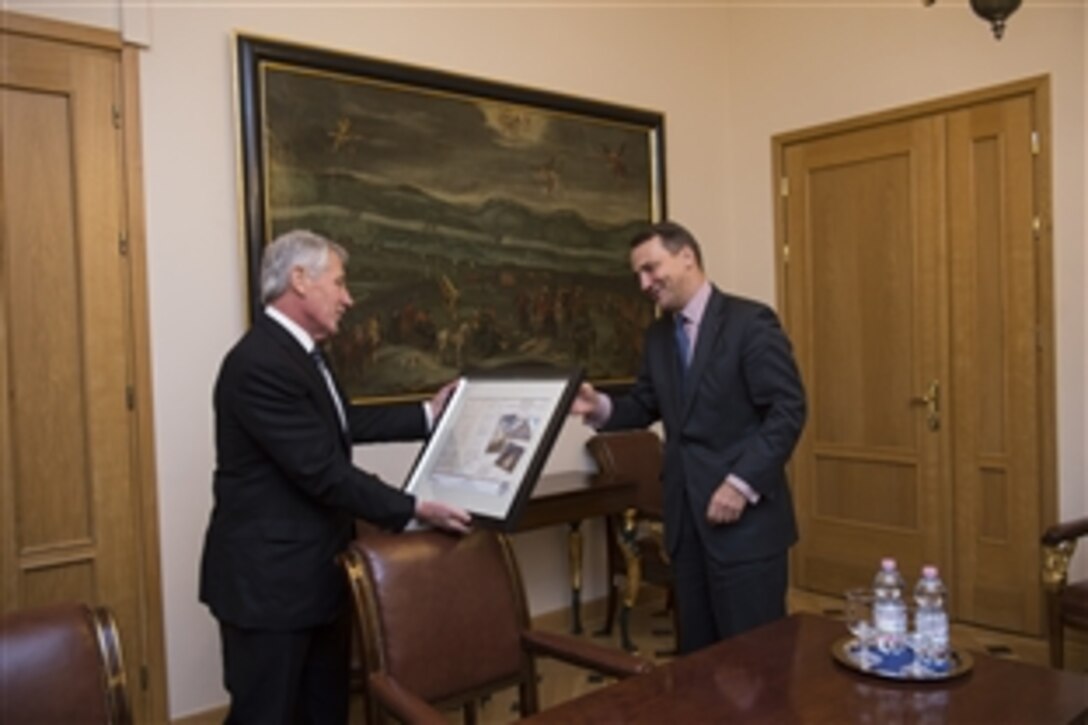 U.S. Defense Secretary Chuck Hagel meets with Polish Foreign Minister Radoslaw Sikorski at the Ministry of Foreign Affairs in Warsaw, Poland, Jan. 30, 2014. Hagel is on a trip to Europe to meet with defense leaders and attend the 50th Munich Security Conference.