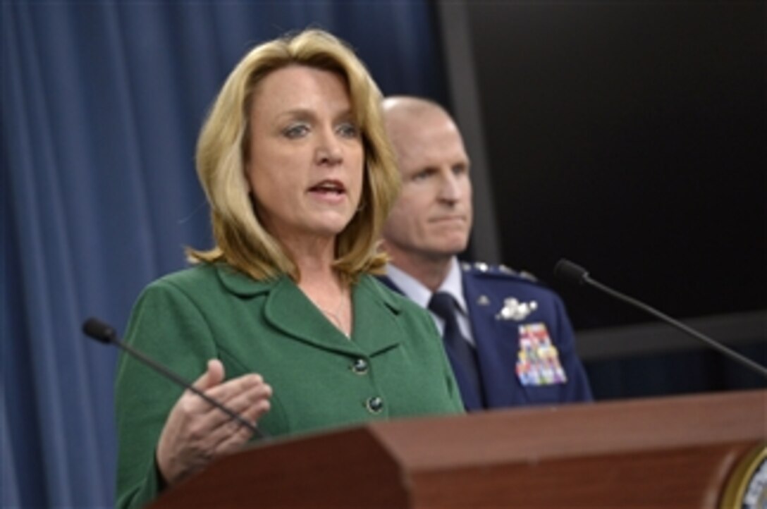 Air Force Secretary Deborah Lee James briefs reporters as Air Force Lt. Gen. Stephen W. Wilson, commander of Air force Global Strike Command, looks on at the Pentagon, Jan. 30, 2014. James discussed her recent trip to Global Strike Command bases and an ongoing Air Force investigation into allegations of compromised proficiency test procedures. James said she had conducted focus group sessions with both officer and enlisted units.