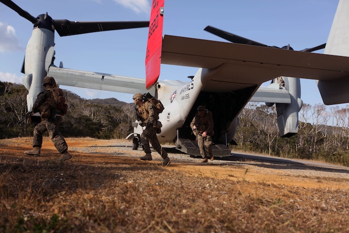 Marines and Sailors with Weapons Company, Battalion Landing Team 2nd Battalion, 5th Marines, 31st Marine Expeditionary Unit, sprint out of the back of an MV-22 Osprey Tiltrotor Aircraft during a Tactical Recovery of Aircraft and Personnel training exercise at the Jungle Warfare Training Center here, Jan 27. The TRAP is one of many capabilities tested during the 31st MEU’s pre-deployment training package. The 31st MEU is the Marine Corps’ force in readiness for the Asia-Pacific region and the only continuously forward-deployed MEU.  