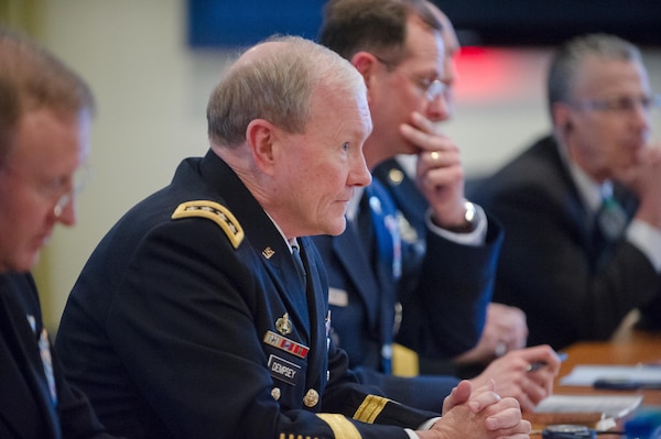 U.S. Army Gen. Martin E. Dempsey, chairman of the Joint Chiefs of Staff, speaks with his Russian counterpart during a NATO meeting for defense chiefs in Brussels, Jan. 21, 2014. Dempsey is on a three-day trip where he is slated to meet with his NATO and Russian counterparts. (DOD photo by U.S. Navy Petty Officer 1st Class Daniel Hinton)