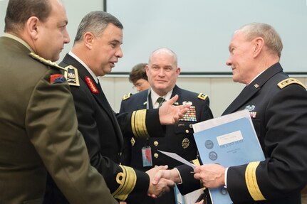 18th Chairman of the Joint Chiefs of Staff Gen. Martin E. Dempsey speaks with Egyptian Deputy Chief of Defense Vice Adm. Ahmed Khaled while attending the 170th NATO Chiefs of Defense meeting at NATO headquarters in Brussels, Belgium, January 22, 2014. DoD photo by Mass Communication Specialist 1st Class Daniel Hinton