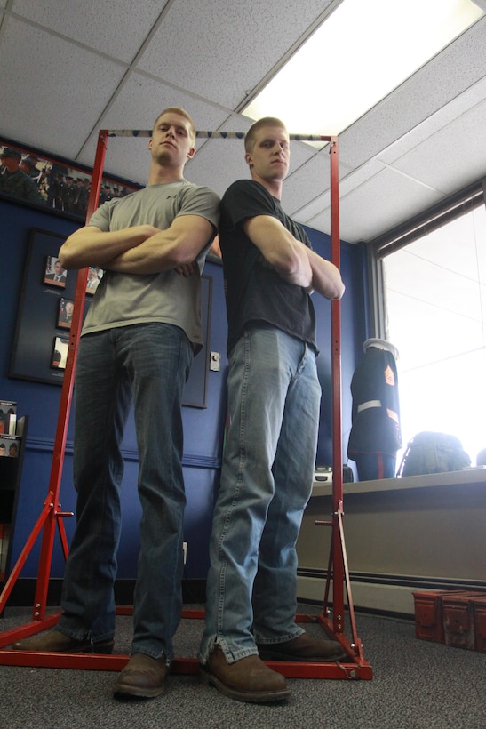 Mike and John Lange, natives of Proctorville, Ohio, pose for a picture in the office of Recruiting Sub-Station Huntington, in Huntington, W. Va., Jan. 28, 2014. Mike and John, who stand at 6 feet 4 inches tall, are identical twins who have enlisted in the Marine Corps and will be attending basic training in February. (U.S. Marine Corps photo by Sgt. Tyler J. Hlavac/Released)